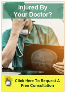 Doctor looking at brain scan. Click the image to go to the contact us page to request your free consultation