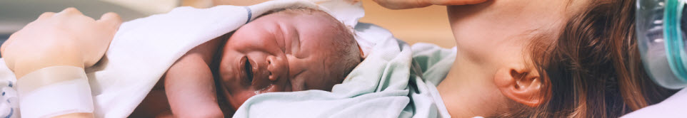 mom holding newborn baby